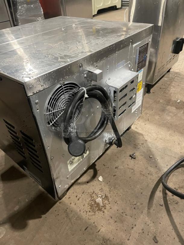 TurboChef NGCD6 commercial stainless steel rapid cook oven, electric, on legs, with digital touch controls, back view.