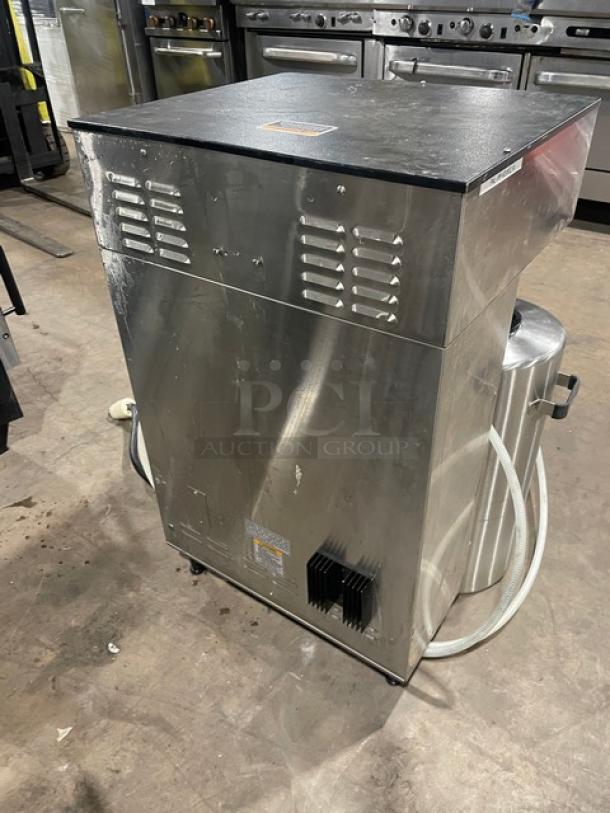 Bunn ThermoFresh DUAL TF DBC commercial coffee brewer, stainless steel, with digital controls, hot water dispenser, on legs.