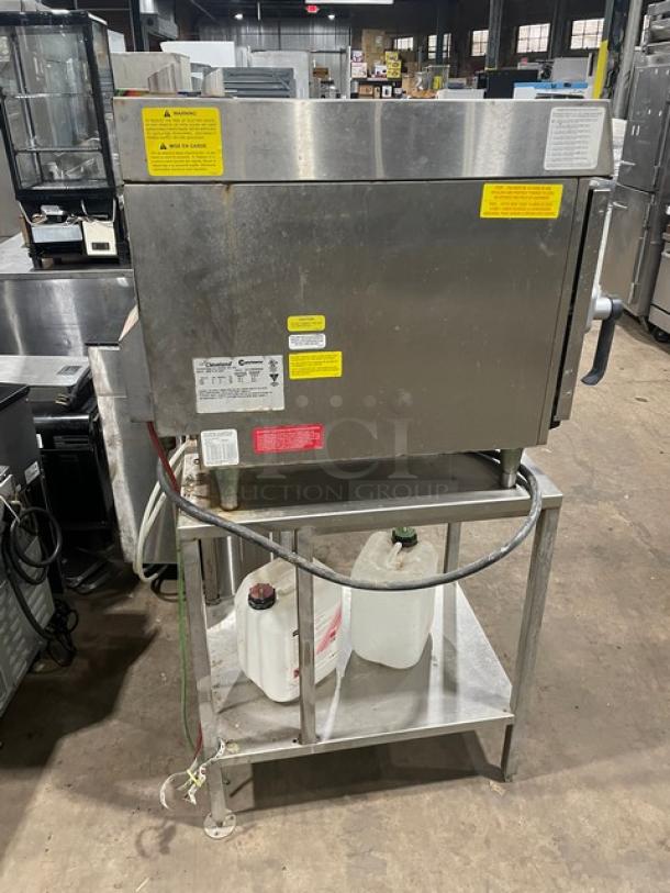 Convotherm stainless steel electric mini combi oven, model OES6.10Mini, on legs with digital controls and undershelf stand. 208/240V 3 Phase. Tags visible.