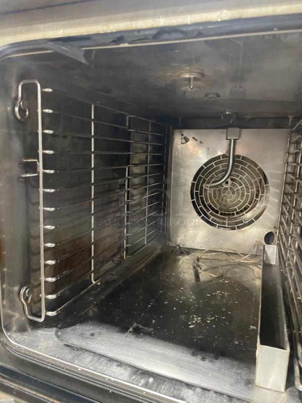 Convotherm stainless steel mini combi oven interior, model OES6.10Mini, showcasing digital controls and fan.