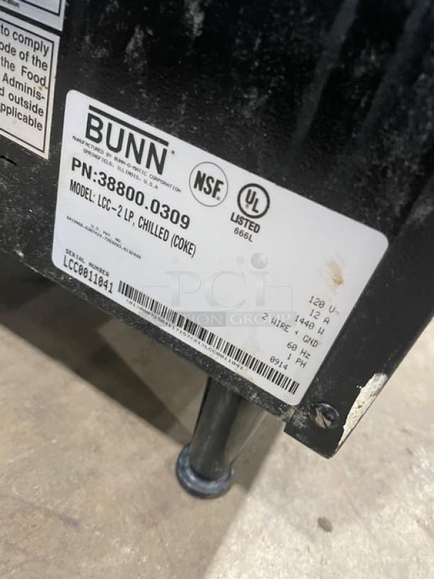 Bunn LCC2LP ambient coffee dispenser, commercial electric, 120V, on legs, model SN: LCC0011041, label shown.