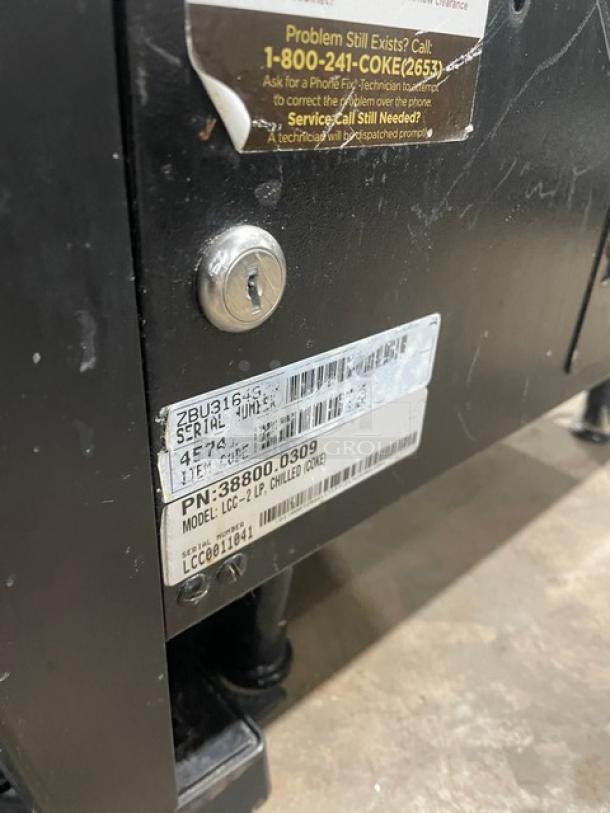 Bunn LCC2LP electric countertop coffee dispenser, model LCC-2LP, SN: LCC0011041, on legs, 120V, 1 phase, with labels.