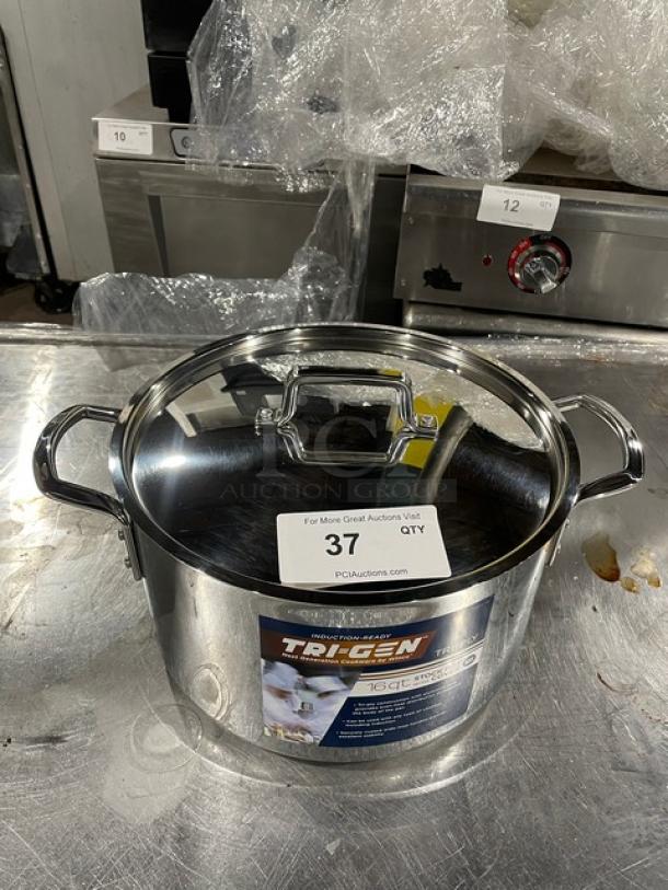 NEW Winco TGSP-16 16 Qt. Induction-Ready Aluminum Stock Pot with Lid, in pristine condition, visible label states model and features.