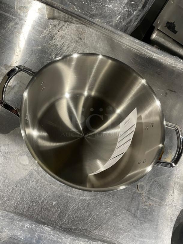 Winco 16 Quart Aluminum Stock Pot, model TGSP-16, induction ready with lid, new condition, visible product label.