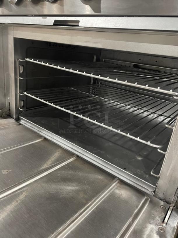 CPG stainless steel 36" range/oven combo, model 351S36N, features 6 burners and wired oven rack. Natural gas powered. Serial: 03224046.
