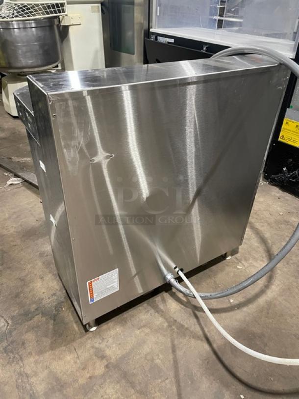 Fetco CBS-62H Twin Coffee Brewer, stainless steel, electric, countertop model, 240V, hot water dispenser, on legs.