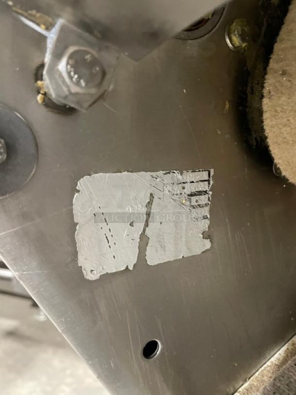 TMB Baking commercial dough sheeter, floor model, stainless steel, electric-powered, on casters, visible wear on the surface.