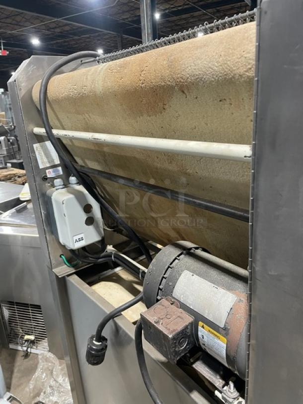 TMB Baking commercial stainless steel electric dough sheeter, floor model on casters, features visible motor and wiring.