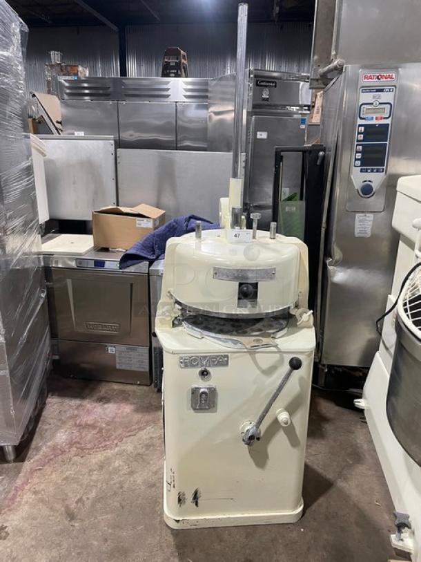 Commercial white electric dough rounder/divider, industrial grade, with visible wear. Markings indicate model and controls.