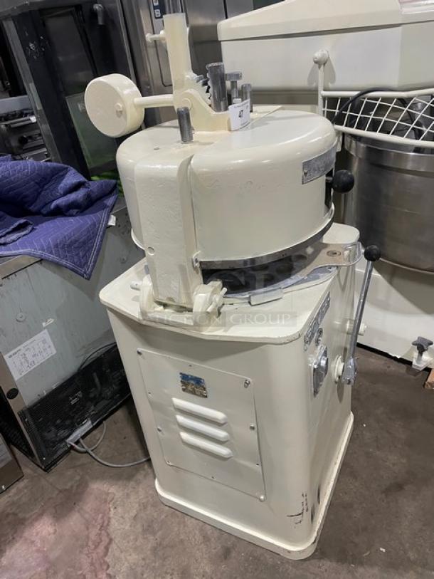 Commercial white electric dough rounder/divider, robust metal build, manual controls, clear function markings, used condition.