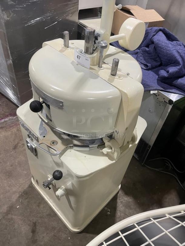 Commercial white electric dough rounder/divider, sturdy metal construction, used condition, adjustable levers, control knobs.