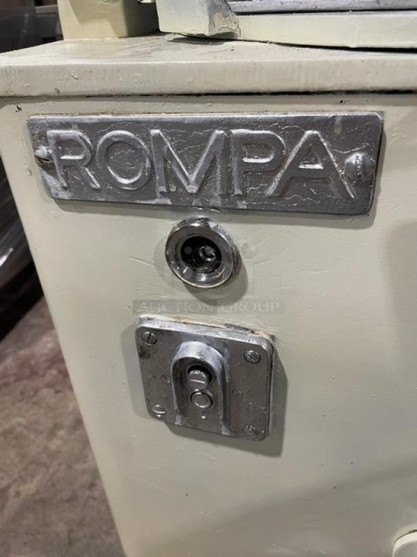 Commercial white electric dough rounder/divider, brand "ROMPA". Features metal hardware, industrial condition.