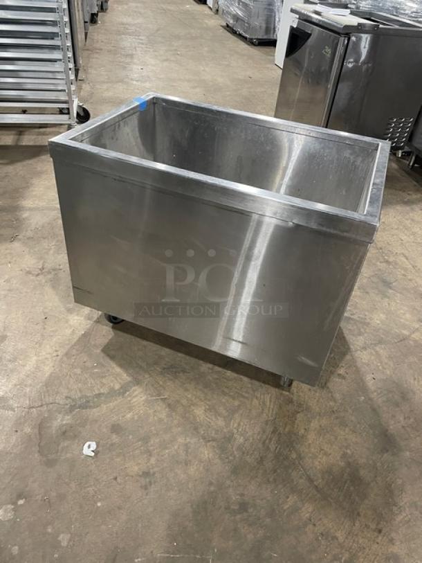 Commercial stainless steel portable ice bin on casters; features durable construction, high capacity, and easy mobility.