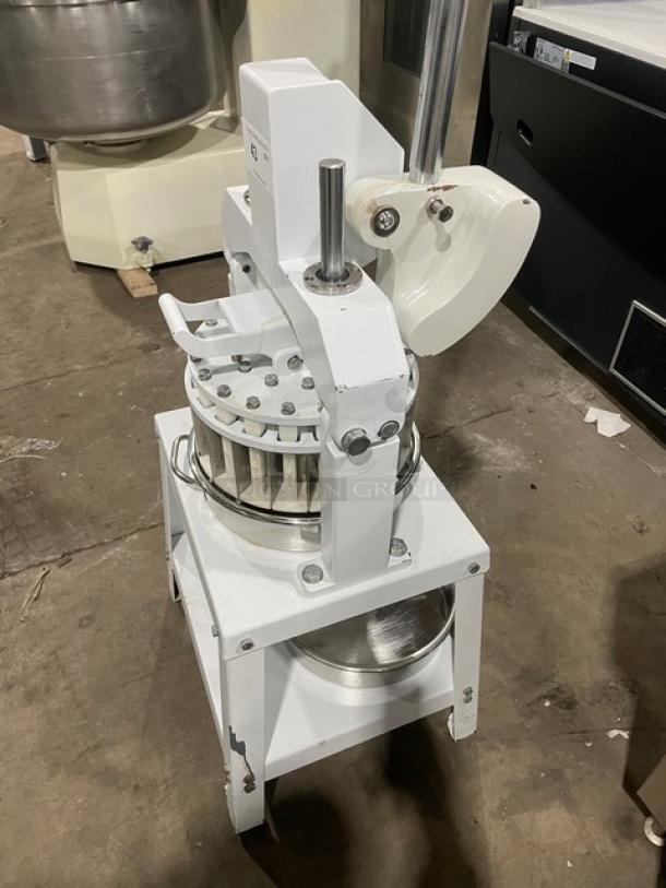 Migsa commercial white manual dough divider with stainless steel bowl, single undershelf, on legs. Good condition.