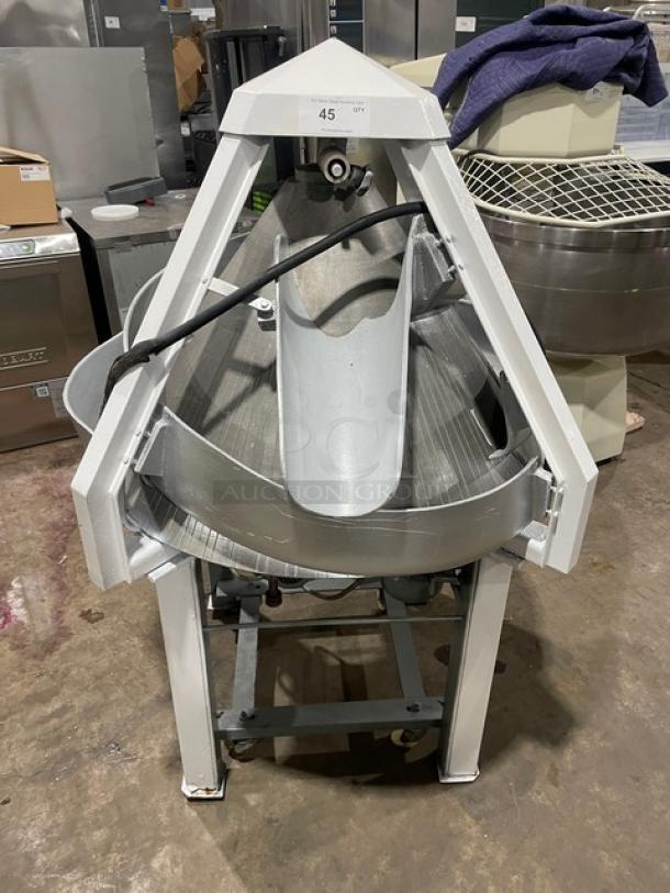 Benier commercial conical dough rounder, electric powered, on legs and casters, in excellent condition, model details visible.