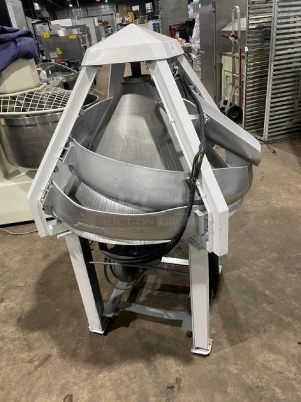 Benier commercial electric conical dough rounder on legs and casters, free-standing, industrial-grade, sturdy construction.