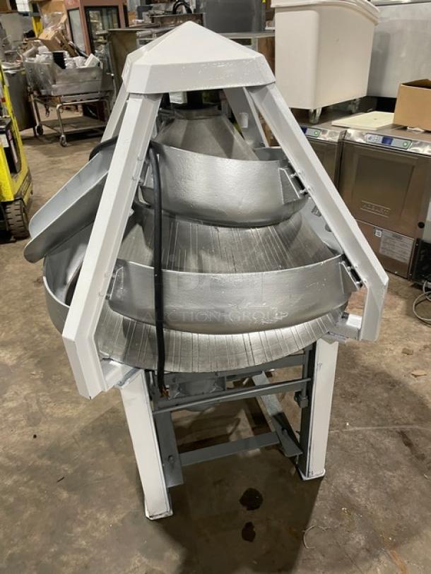 Benier commercial electric-powered free-standing conical dough rounder, metal construction, on legs and casters, used condition.