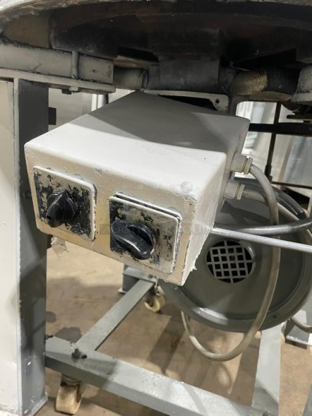 Benier commercial electric conical dough rounder on wheeled legs, featuring control knobs and robust metal construction.