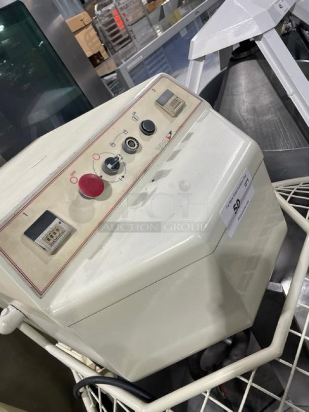 VMI SPI220M commercial spiral mixer with bowl guard, stainless steel bowl, controls panel, and spiral dough hook attachment.