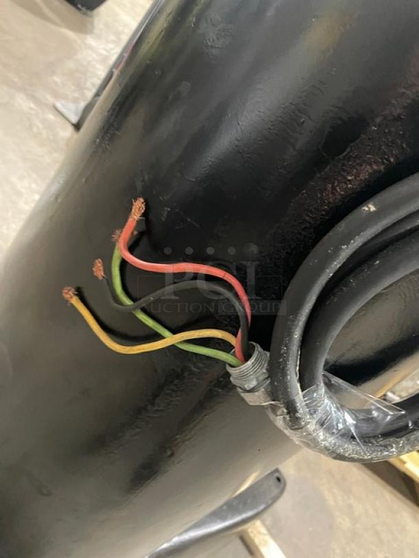 Hobart M802 commercial black electric floor-model dough mixer wiring detail, showing exposed colored wires.