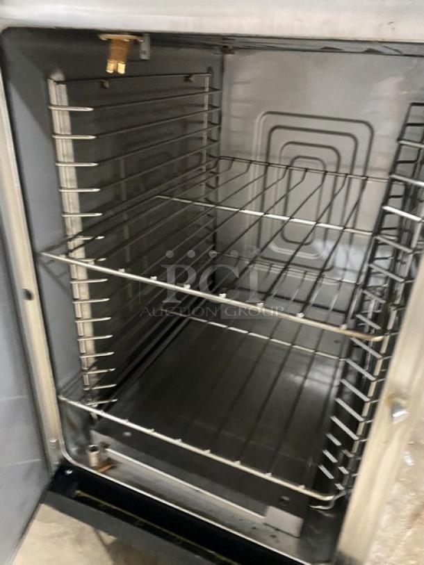 Alto-Shaam 1200-TH Halo Heat Cook-N-Hold oven, 2022 model, stainless steel, with wired rack, simple controls, on casters.