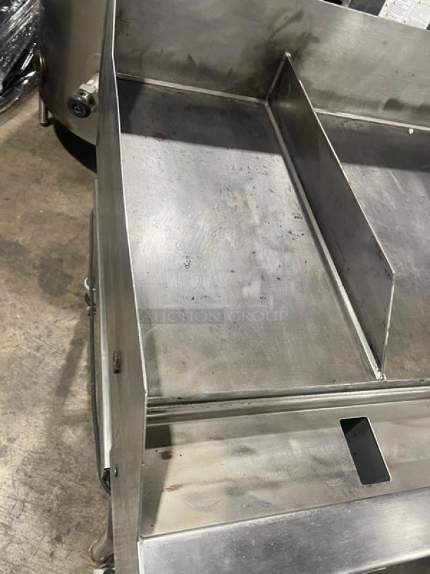 WoodStone stainless steel natural gas plancha griddle with back and side splash, undershelf stand on casters, used condition.