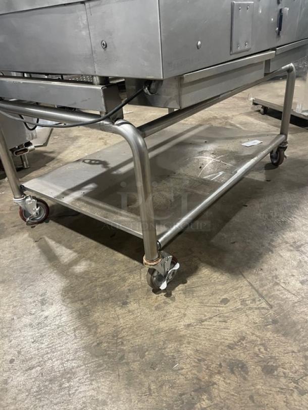 WoodStone stainless steel gas countertop plancha with back and side splash, on undershelf stand with casters, used condition.