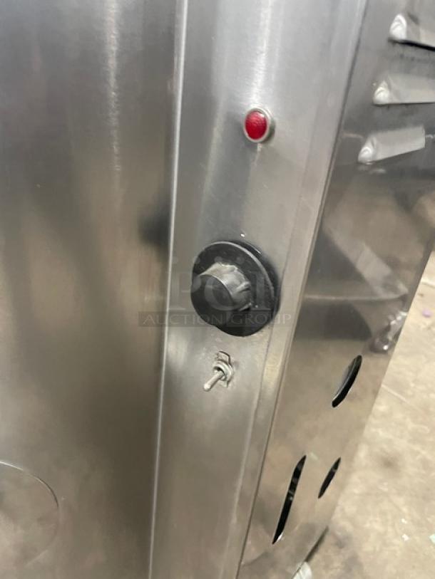 Groen AH140 steam kettle, stainless steel, gas-powered, 40 lb capacity, control panel with knob and light indicator, on legs.