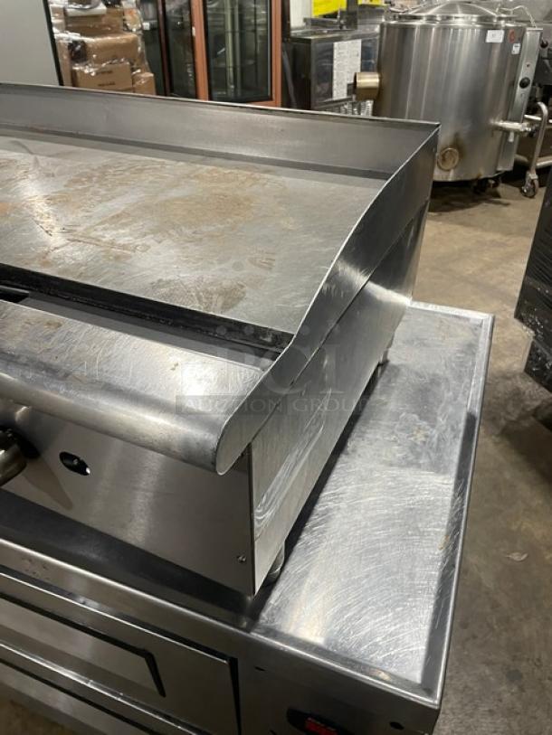 Cecilware Pro stainless steel gas-powered countertop griddle with back and side splash, on legs. Used condition.