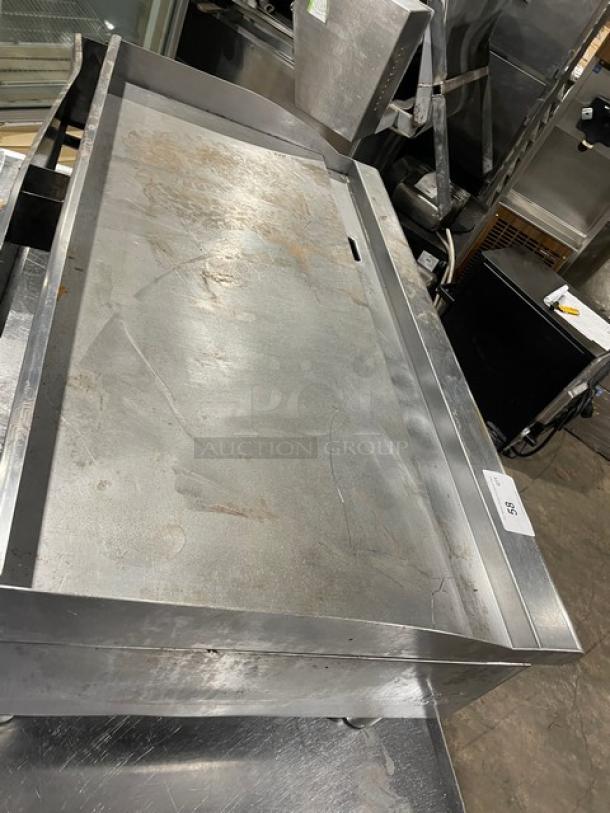 Cecilware Pro Series stainless steel gas countertop flat griddle with back and side splash, mounted on legs. Used.