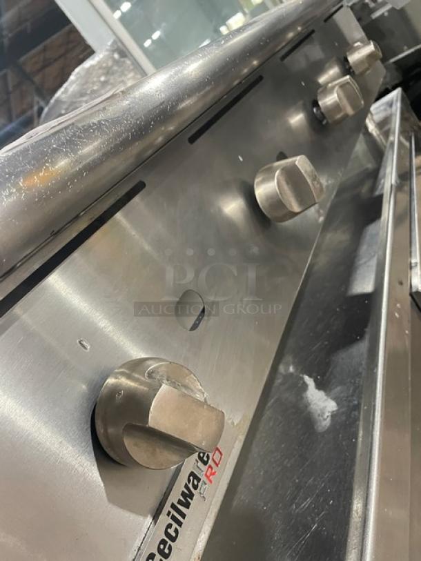 Cecilware Pro Series stainless steel gas-powered countertop griddle with back and side splash, adjustable knobs, and branded label.