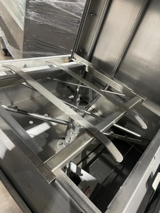 Jackson TEMPSTARHHEVER commercial stainless steel dishwashing machine interior, showcasing spray arms and rack system.