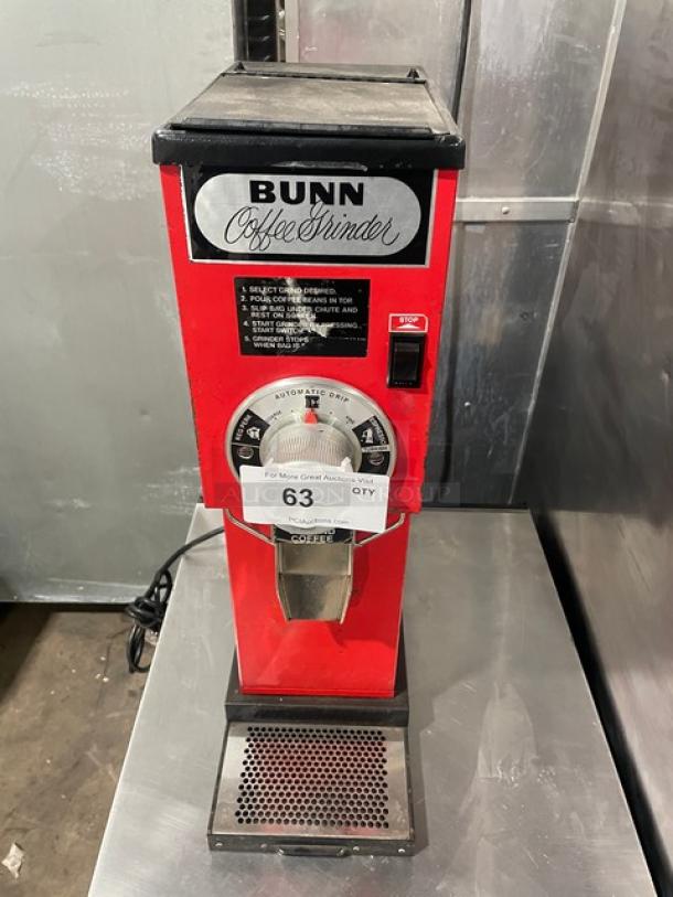 Bunn G3 red electric bulk coffee grinder, model G3 SN: 8406, 120V, 1 phase, with control dial and stop button.