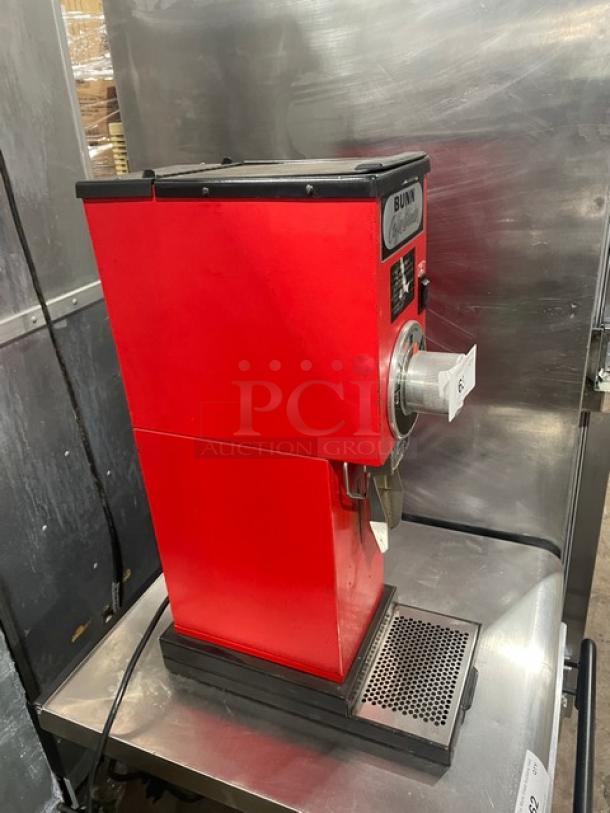 Bunn G3 red countertop bulk coffee grinder, electric powered, 120V, serial number 8406, in good condition.