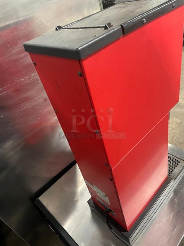 Bunn G3 red commercial coffee grinder, electric, countertop model. Features durable construction. Condition appears good. Serial number 8406.