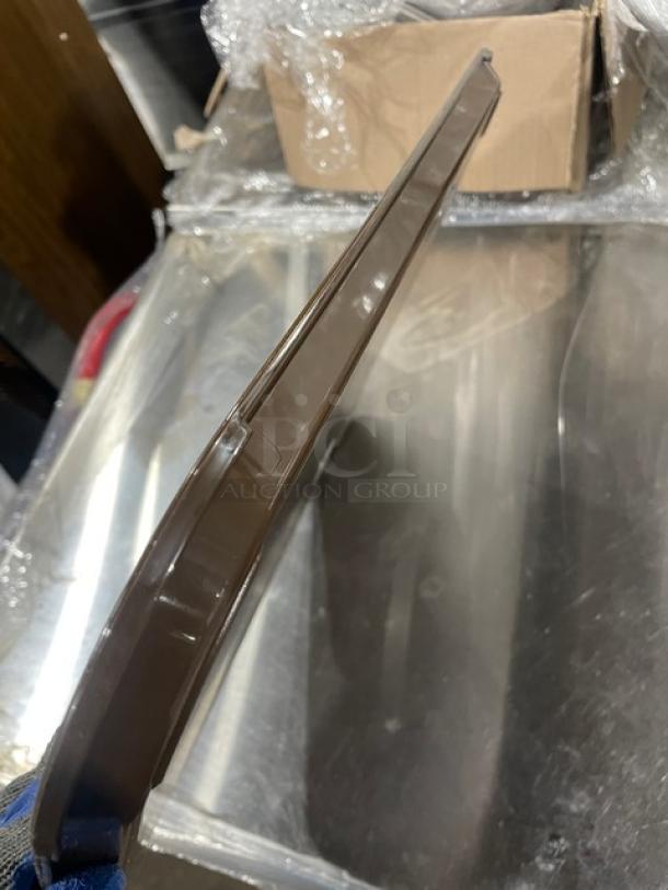 Cambro 1418FF167 brown 14"x18" rectangular tray in new condition, ideal for fast food or serving.