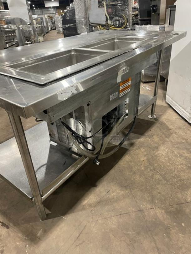 Delfield 8148EFNP stainless steel 2-well refrigerated food table. Features single undershelf, electric powered, on legs.