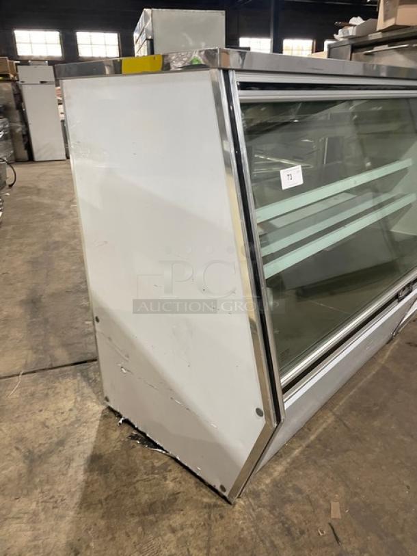 Leader ERHD72ES refrigerated deli/meat display, stainless steel 72", slanted glass, adjustable shelves, lower storage, rear sliding doors.