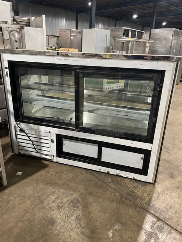 Leader ERHD72ES 72" stainless steel refrigerated display, slanted glass, adjustable shelves, lower storage, sliding doors.