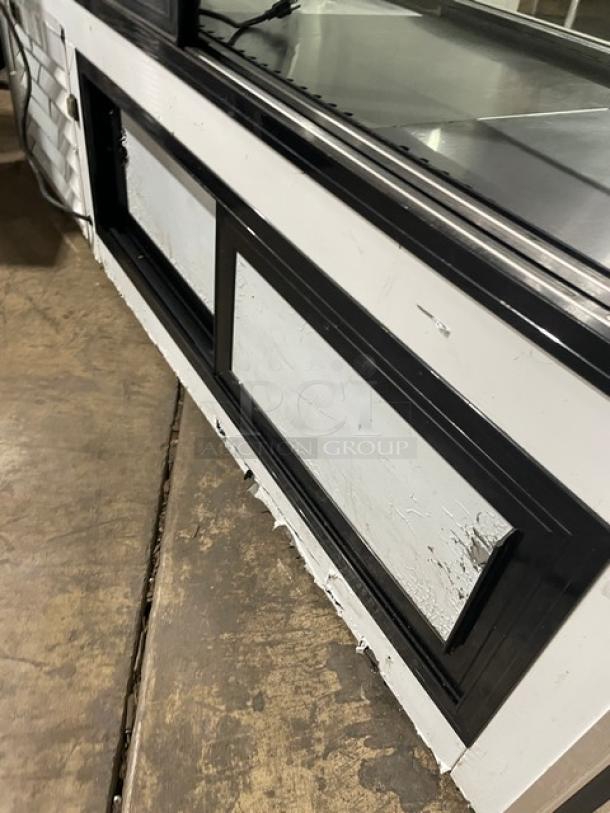 Leader 2020 stainless steel 72" refrigerated display, Model ERHD72ES, with slanted glass, shelves, storage, and sliding doors.