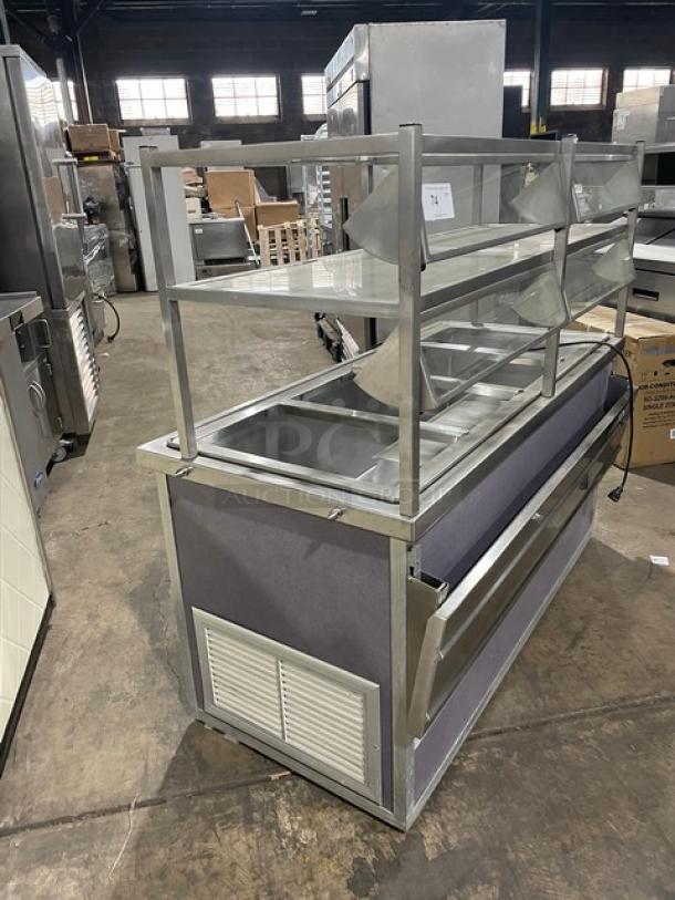 Atlas Metal stainless steel refrigerated buffet salad bar, model WCMBT4, 4-well with sneeze guard, tray slide, storage underneath, on casters.