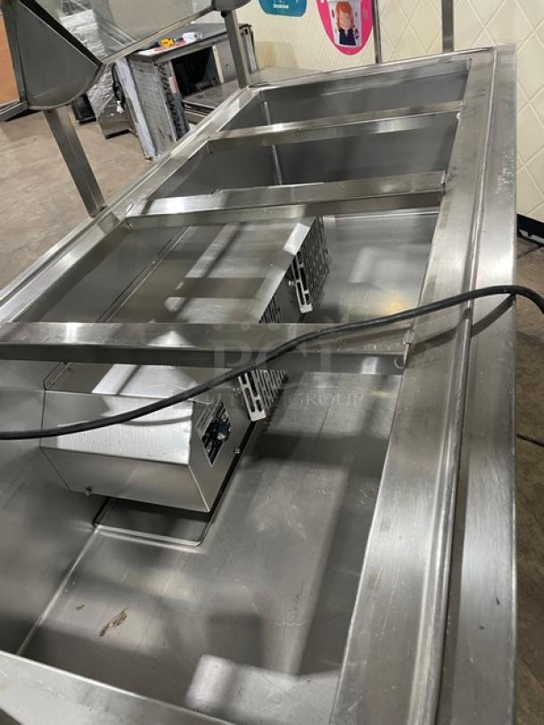 Atlas Metal refrigerated 4-well salad bar, model WCMBT4. Stainless steel, with sneeze guard, tray slide, and storage.