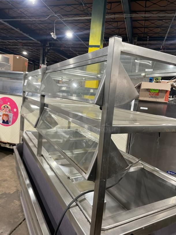 Atlas Metal WCMBT4 stainless steel refrigerated salad bar with sneeze guard, four wells, tray slide, and enclosed storage.