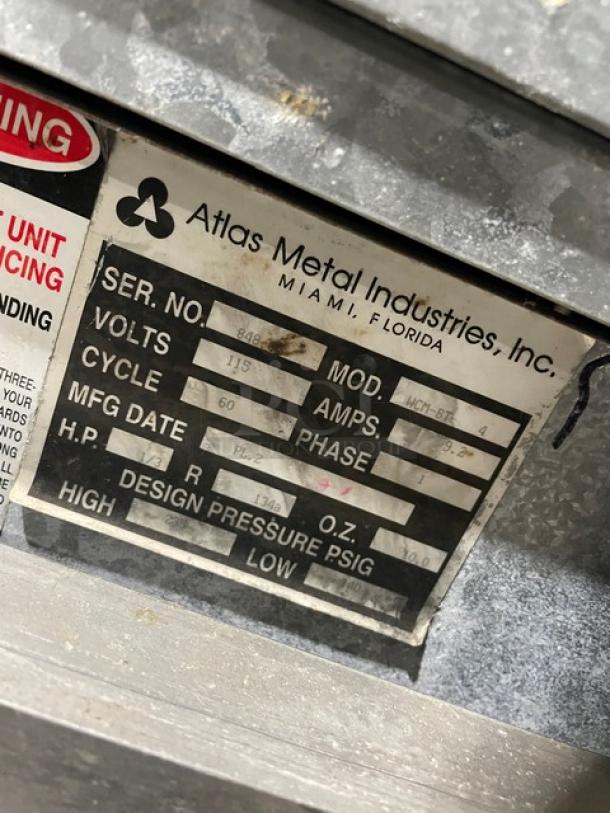 Atlas Metal WCM-BT-4 label showing model, serial number 848-0, and specifications.