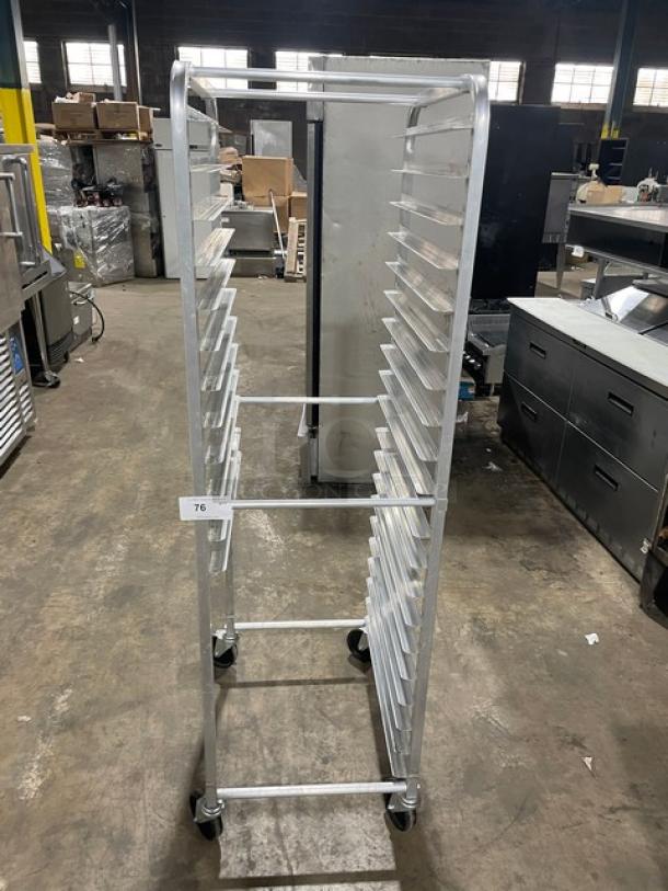 Commercial heavy-duty pan holding rack on casters, 20 slots, aluminum, excellent condition, tag number 76 visible.