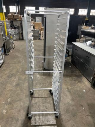 Commercial heavy-duty pan holding rack on casters, 20 slots, aluminum, excellent condition, tag number 76 visible.