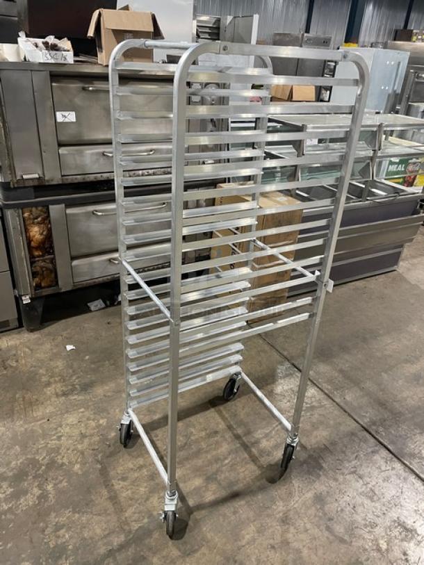 Commercial heavy-duty pan holding/transport rack on casters, metal, multiple shelves, used condition, suitable for bakery or restaurant use.