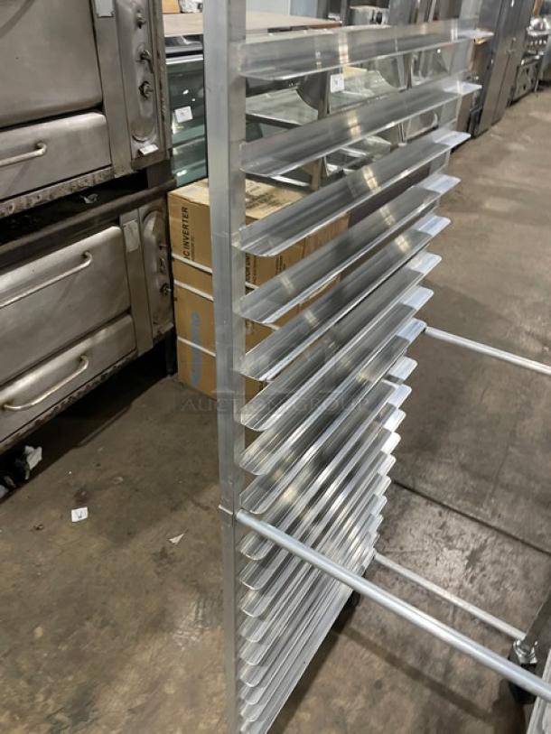 Commercial heavy-duty pan rack with multiple slots, on casters for easy transport. Stainless steel, excellent condition.