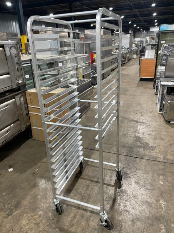 Commercial heavy-duty pan holding/transport rack with 18 slots on casters. Made of durable metal. Good condition.