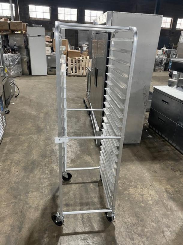 Commercial heavy-duty pan holding rack on casters, silver metal, multi-tiered, excellent condition, item 77 tag visible.